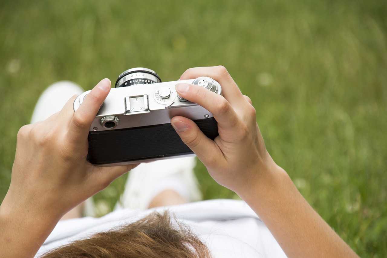person checking photos on camera